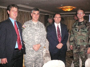 Gathering for the September meeting are (l-r) Lt. Col. Kenneth Crane, USAF; Max OBrien, Booz Allen Hamilton; Col. Eric Albert, USA; and Steve Kane, Booz Allen Hamilton.