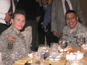 Lt. Col. Heidi Gebhardt, USA, talks with Maj. Ivan Montanez, USA, at the chapter meeting in September.