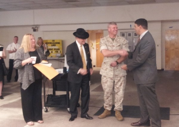 In March, Lee Cantrelle (r), chapter president, presents a $1,000 science, technology, engineering and mathematics (STEM) grant to Col. Bill Davis, USMC (2nd from r), commandant, New Orleans Military and Maritime Academy; Col. Terry Ebbert, USMC (Ret.), board president; and Dr. Cecilia Garcia, principal.