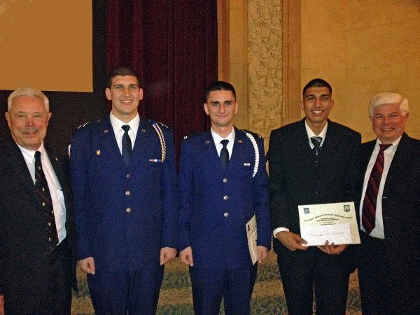 Bob Moorhead (r), chapter president, and Robert Landgraf (l) present scholarships to Air Force ROTC cadets Frank Rosette, Calvin Craig and Harman Purewal from Detachment 045 at San Jose State University in December.