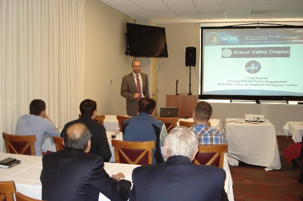 Craig Buehler, the director of private-sector engagement for the Northern California Regional Intelligence Center (NCRIC), San Francisco, discusses the center's mission with chapter members and guests in November. 