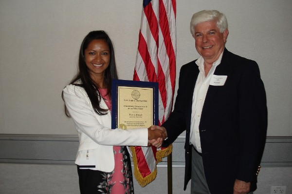 In August, Reema Prasad accepts a certificate of appreciation from Morehead for her presentation on Internet security.