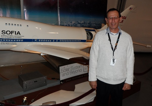 Following his presentation in February, Chavez stands in front of a model of the Stratopheric Observatory for Infrared Astronomy (SOFIA).