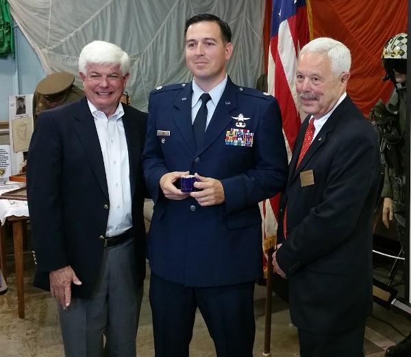 Chapter President Bob Moorhead (l) presents Col. Oti (c) a memento along with Bob Landgraf, regional vice president, at the May event.