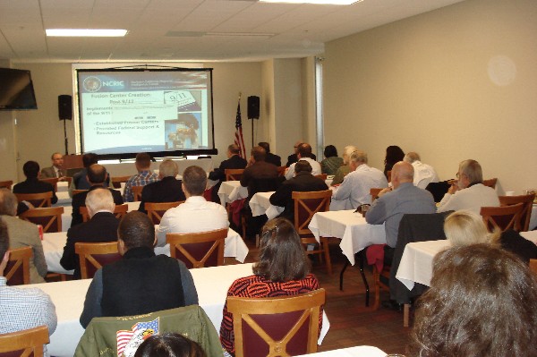 At the November chapter meeting, Buehler speaks about the stand-up of the NCRIC Fusion Center after the 9/11 tragedy.