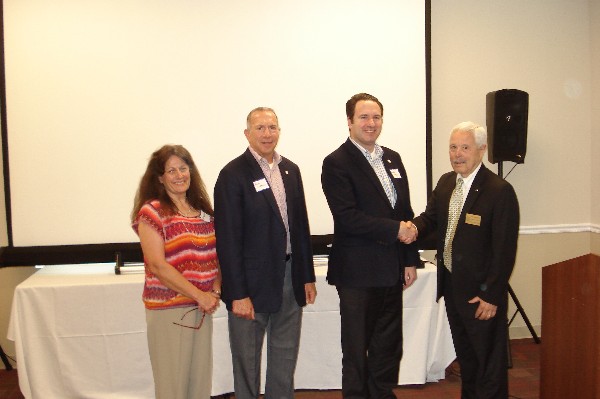 The chapter welcomes two new officers at the May meeting. Andrew Watters (c), vice president for Young AFCEAN affairs, receives congratulations from fellow officers (l-r) Mary Buchanan, Glenn Kesselman and Bob Landgraf, Northern California regional vice president. Not pictured is Jason Becerra, Northern California Region Young AFCEAN.