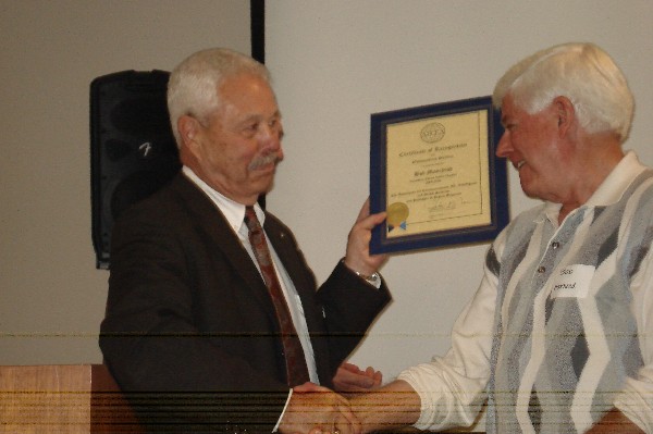 Landgraf (l) presents Bob Moorhead, past president of the chapter, a certificate of recognition for outstanding service at an August meeting.