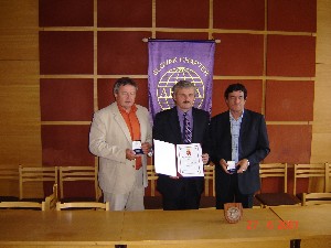 In June, Jan Kurty (c), professor at the Academy of Armed Forces of General Milan Rastislav Stefanik, Liptovsky Mikulas, confers a commemorative plaque to Ladislav Kollarik (l), chapter first vice president, and Ondrovic in thanks for the chapter's longtime cooperation with the school.