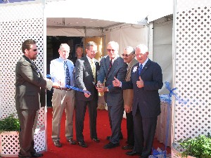 Lt. Gen. John A. Dubia, USA (Ret.), gives a thumbs-ip at the ribbon cutting ceremony at the C41 Systems Technology Exhibition in October. The ceremony also featured the Buena High School marching band, which performed the Star Spangled Banner, and posting of the colors by the VFW Post 9972 Honor Guard. 