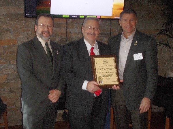 Sullivan (r) and Rossetti (l) present a special award at the February meeting to Dr. Tim Rudolph from the Air Force Life Cycle Management Center.