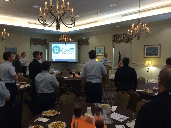 Lt. Cmdr. Steven Myers, USCG, vice president of Southern New England Young AFCEA, leads the audience in the Pledge of Allegiance to kick off the chapter's October event.