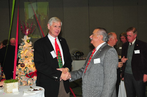 In January, 2014 Chapter President Tony Orlando (r) congratulates 2015 Chapter President Pearsall on his election victory.