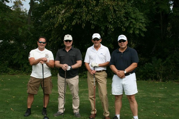 From l-r: James Eccleston of Eccleston Services; John Quigg of Alexa Strategies; Mark Orndorff, DISA's chief information assurance executive; and Craig Young of DDC IT Services gear up for the September chapter golf tournament.