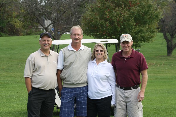 DISA team members raising scholarship funds at an October golf tournament are (l-r) Jeff Otto, Mike Krugh, Ruth Carbaugh and Terry Gregory.