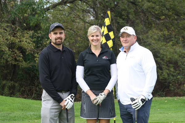 In October, Chris Pereschuk (l), NOVA; Pam Plesz, chapter president; and Eric Winnicky, Commscope, participate in the chapter's golf tournament.