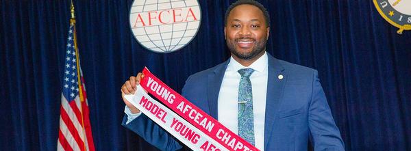 Master Sgt. Reginald Keitt, USA, chapter Young AFCEA president, holds the chapter award ribbons at WEST 2020 in March.