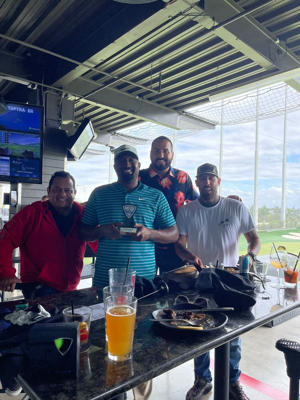 Third Place, Jared Mathis, U.S. Southern Command, hangs out with Team GDIT and Chapter President Jay Anson at the October event.