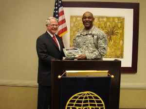 Col. Herb Newman, USA (r), chapter president, presents Lt. Gen. John A. Dubia, USA (Ret.), with a chapter gift after his guest presentation in April.
