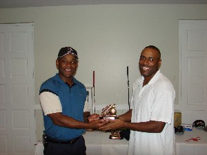 Miami: (Pictured from left) COL Herb Newman, AFCEA South Florida Chapter President congratulates MSgt Shawn Paterson for Closest to the Pin award.