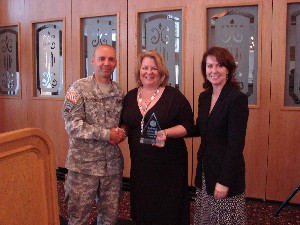 At the February meeting, Jill Tummler Singer (r), deputy chief information officer (CIO), Central Intelligence Agency, and Col. Mark Churchwell, USA (l), CIO and director, Enterprise Support, Command, Control, Computers, Communications and Intelligence, U.S. Southern Command, and chapter president, congratulate Brenda Morris, the recipient of the chapter's first AFCEAN of the Quarter award. 