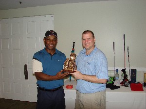 Miami: (Pictured from left) COL Herb Newman, AFCEA South Florida Chapter President presents Mr. Rob Kubat, SeaMobile, Director of Finance, with the prize for Longest Drive.