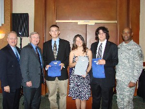 Mark Nehmer, business development manager, SGIS, and chapter scholarship chair (l); Maj. Gen. Bryan (second from left); and Col. Newman (r) present scholarships to Matthew Stankowicz (l-r), Mirela Vasconcelos, and Joshua Eisenberg at the May luncheon. Not pictured: Mylo Cheng. 