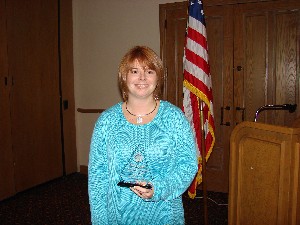 Patti Botteicher, lead strategist at Lockheed Martin, accepts the award as AFCEAN of the Quarter in April.