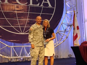 In August, Col. Churchwell presents Melissa Nelson, chair of the scholarship committee, with the chapter's AFCEAN of the Quarter Award.