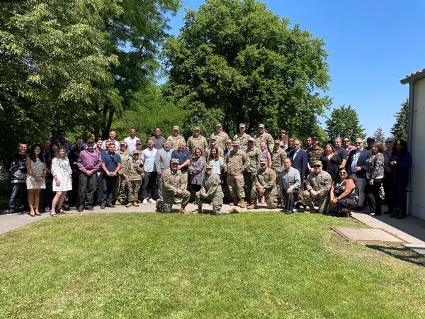 Event attendees pose for a photo for the June 2022 Stuttgart Chapter Kickoff Luncheon.