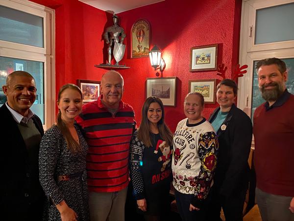 As part of the December chapter event, members enjoy a costume contest. (l-r) Michael Young, V2X; Alisha Kelly, Trace Systems; Col. Jon Goodman, USAF, European Command (EUCOM); Nicola Thompson, U.S. Africa Command (AFRICOM); Lt. Col. Eva Millare, AFRICOM; Col. Diane Klein, USA, Defense Information Systems Agency European Field Command; and Todd Weingeroff, Motorola smile for the camera. Photo by Lt. Gen. Chad Raduege, USAF, EUCOM.