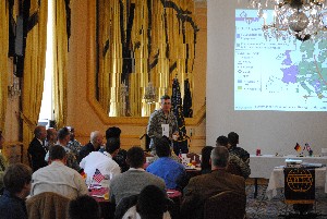 Col. Mark C. Luchs, USAF, director of communications and chief information officer, U.S. Special Operations Command Europe, addresses the chapter on the changing threats in Europe and Africa at the October luncheon.