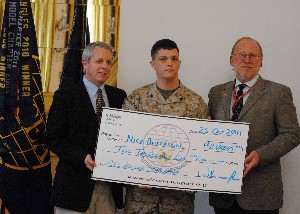 Roger Carpenter (l), chapter president, and William Kroelinger (r), CSC site manager at the Defense Information Systems Agency Europe, present Sgt. Nicholas Andersen, USMC, with the AFCEA/CSC Defense Technical Certification Scholarship in October.