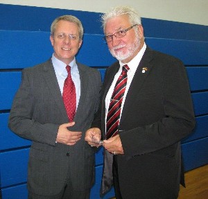 During the 2011 Summer Tech Expo in July, Roger Carpenter (l), chapter president, presents a new chapter coin to Dieter Zechai, secretary of the Bonn Chapter.