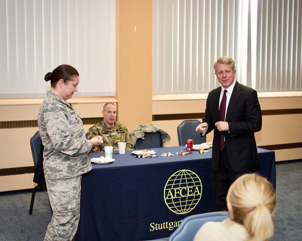 Chapter President Roger Carpenter presents Col. Gibson a chapter coin as a token of appreciation for her time and support as the September guest speaker.