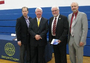 In July, AFCEA members gathering at the Summer Tech Expo are (l-r) Christopher McIntire, chapter vice president of publicity; Joe Page, chapter secretary; Zechai; and Gus Anderson, chapter corporate vice president.