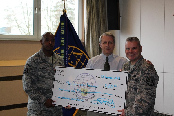 Master Sgt. Donald G. Blackmon Jr., USAF (l), Defense Information Systems Agency Europe, and Carpenter (c) recognize Tech. Sgt. Christopher Provencher, USAF, as the chapter's Service Member of the Quarter in November.