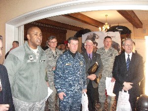 Senior leaders interacting with vendors at the February Tech Expo are (l-r) Col. Price; Col. Mark C. Luchs, USAF, Special Operations Command Europe; Rear Adm. John G. Messerschmidt, USN, U.S. European Command (EUCOM); Page; Lt. Col. Randall G. Sparks, USAF, EUCOM/J-6; and Carpenter.