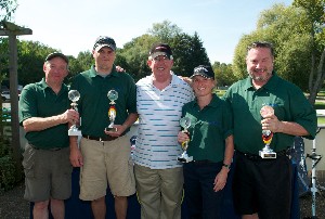 In September, Joseph Page (c), chapter secretary, joins the winning team from the scholarship golf tournament, which includes M.C. Dean Incorporated representatives (l-r) Russ Chittick, Chris Inman, Kristen Gilbert and Keith Siville.