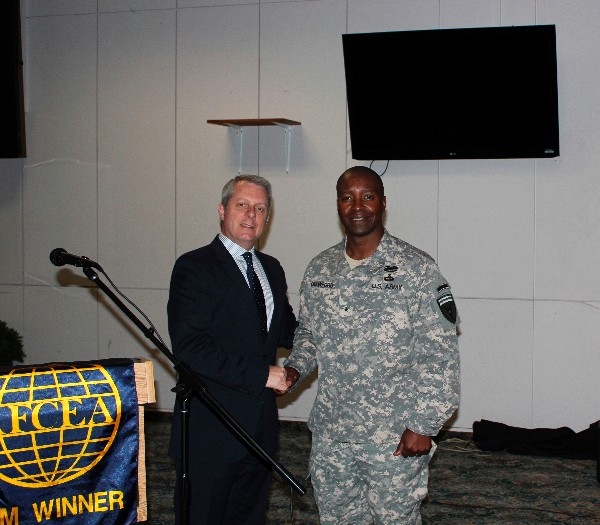 Roger Carpenter (l), chapter president, presents Gen. Crawford with a chapter coin and plaque to thank him for speaking at the chapter's October luncheon.