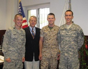 ROTC cadets visiting with Carpenter (2nd from l) are Air Force Cadet Alexander C. Young (l), North Carolina State University; Navy Midshipman David Allen Cox (2nd from r), Iowa State University; and Army Cadet Joseph B. Maxwell, Auburn University.