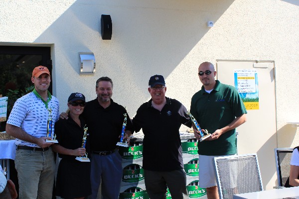 At the scholarship golf tournament in September, Dr. Joe Page (2nd from r), chapter secretary, presents trophies to Kristen Gilbert, Keith Siville and fellow MC Dean teammates.