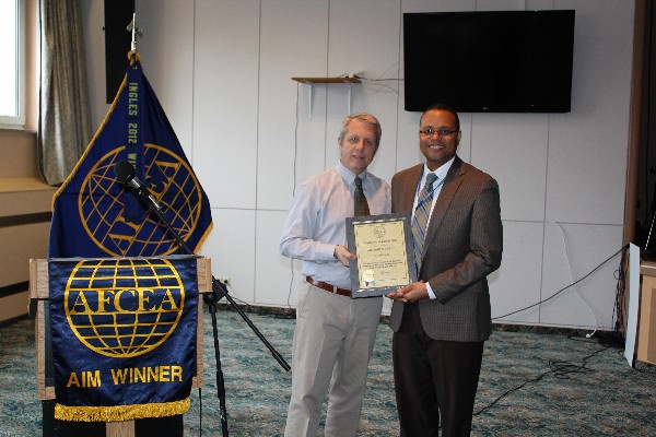 In November, Carpenter (l) congratulates Art Kelly and presents him with an AFCEA Lifetime Membership certificate.