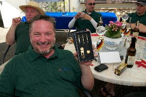 The winning team at the September scholarship golf tournament receives a gold Presidential Tee set.