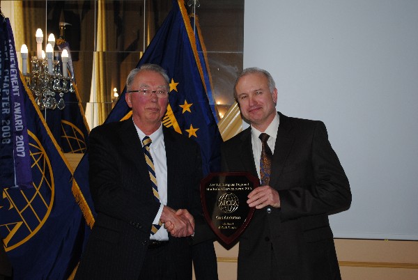 In April, Bill Schlichter (l), regional vice president, presents Gus Anderson, chapter corporate vice president, with the AFCEA European Regional Meritorious Service Award 2012 for his work with corporate sponsors. 