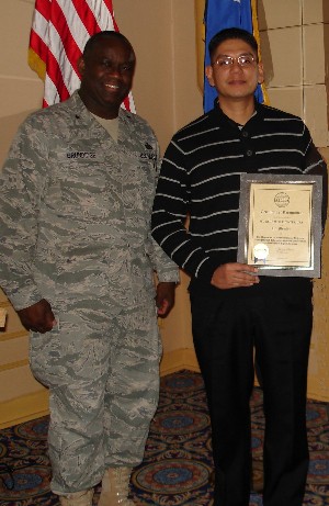 At the January chapter luncheon, Brig. Gen. Gregory L. Brundidge, USAF (l), director, European Command (EUCOM) J-6, presents an AFCEA Lifetime Membership certificate to Sgt. 1st Class Rodolfo Fuentes, USA.