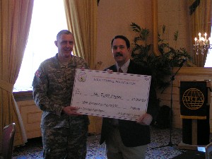 COL Mike Curry (l), Commander of DISA-Europe and President of the Stuttgart Chapter, presents a $1,000 check to Mr. Todd Taylor (r), Patch High School educator. The 2007 Science Teaching Tools Award from the Stuttgart Chapter was presented with the help of AFCEA's Educational Foundation and recognizes Mr. Taylor for supporting the Stuttgart Chapter's scholarship awards over the last several years.