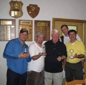 Dan Starr (l), Don Benton (2nd from l), Ken Asbury (r) and Joe Wingate (back r) accept their trophies from Dr. Joe Page (c), the September fundraiser's coordinator. 