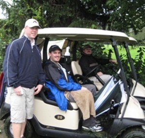 Jean Bayol (l), Aaron Unger (c) and Brad Morgen wait for their turn on the course during the September golf tournament and fundraiser. 