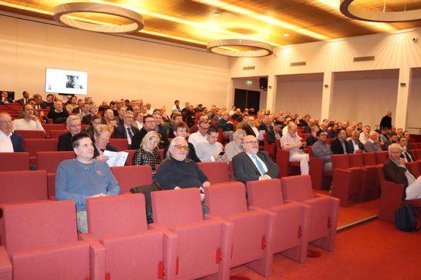 Visitors to the DCWC Cyber Symposium enjoy presentations and discussions during the March event.
