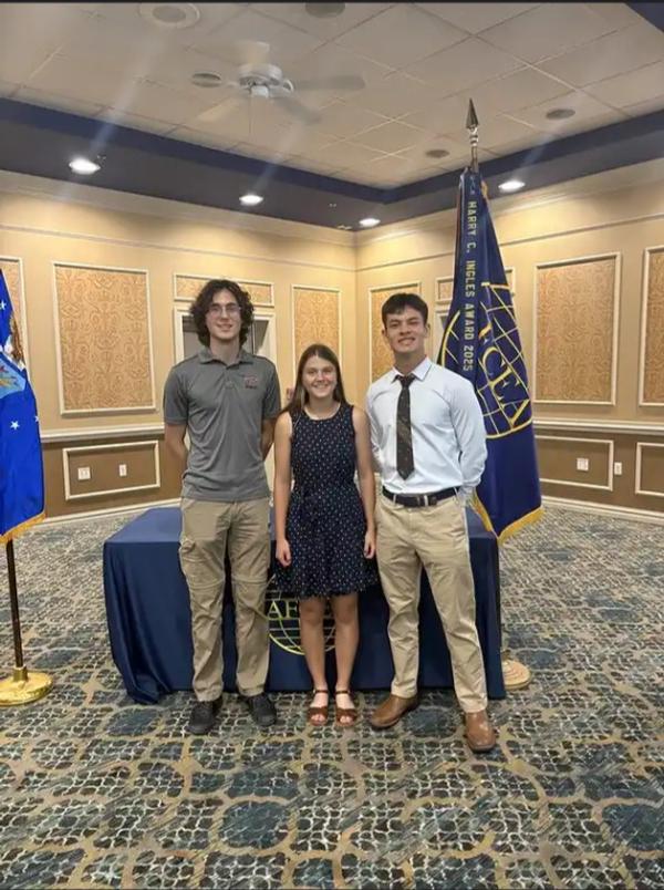 Scholarship winners, Doniyor Babajanov, Meagan Way and Lucas Powell-Riedl, pose for a photo at the July luncheon. 